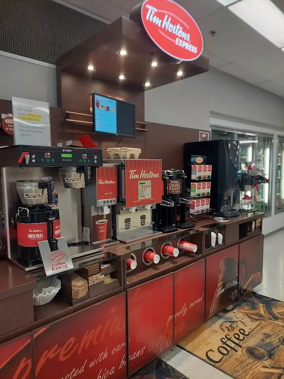 Tim Hortons storefront and interior at Moose Jaw Expressmart, Bushell Park, SK