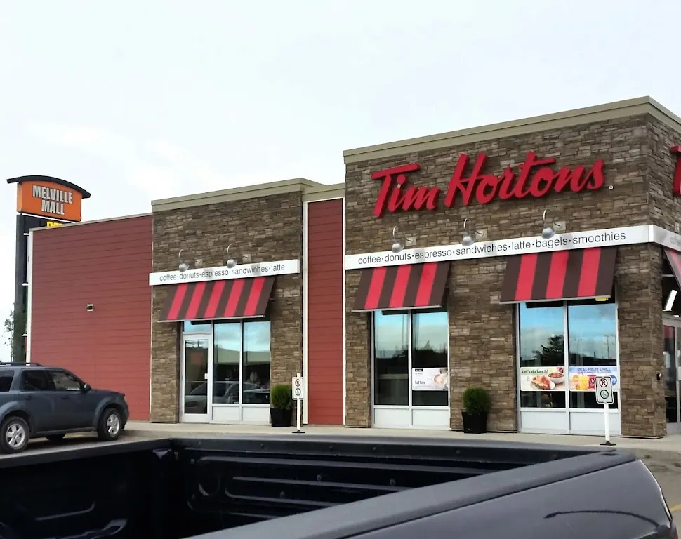Tim Hortons storefront and interior at 290 Prince William Dr, Melville, SK