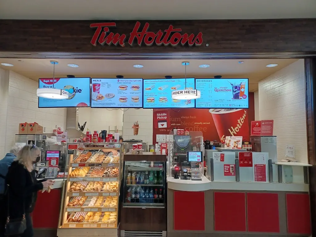 Tim Hortons storefront and interior at 300 Confederation Dr, Saskatoon, SK