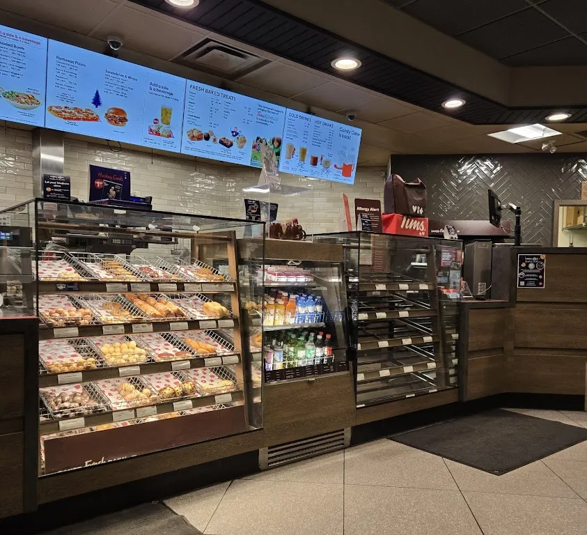 Tim Hortons storefront and interior at 709 Circle Dr East, Saskatoon, SK
