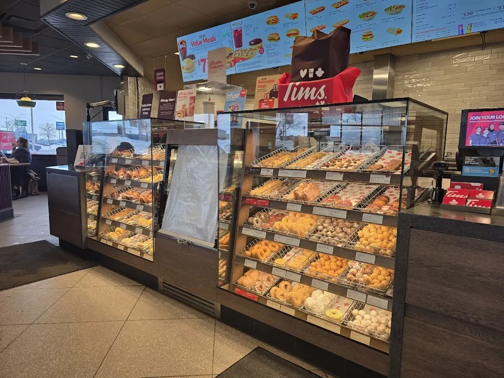 Tim Hortons storefront and interior at 810 Circle Dr E, Saskatoon, SK