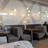 Tim Hortons storefront and interior at 2625 Airport Dr, Saskatoon, SK