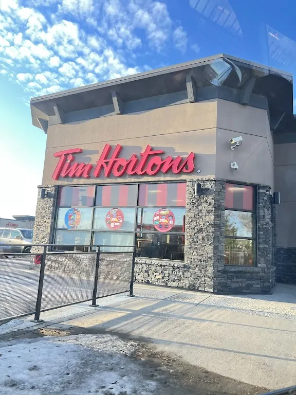 Tim Hortons storefront and interior at 3134 Clarence Ave S, Saskatoon, SK