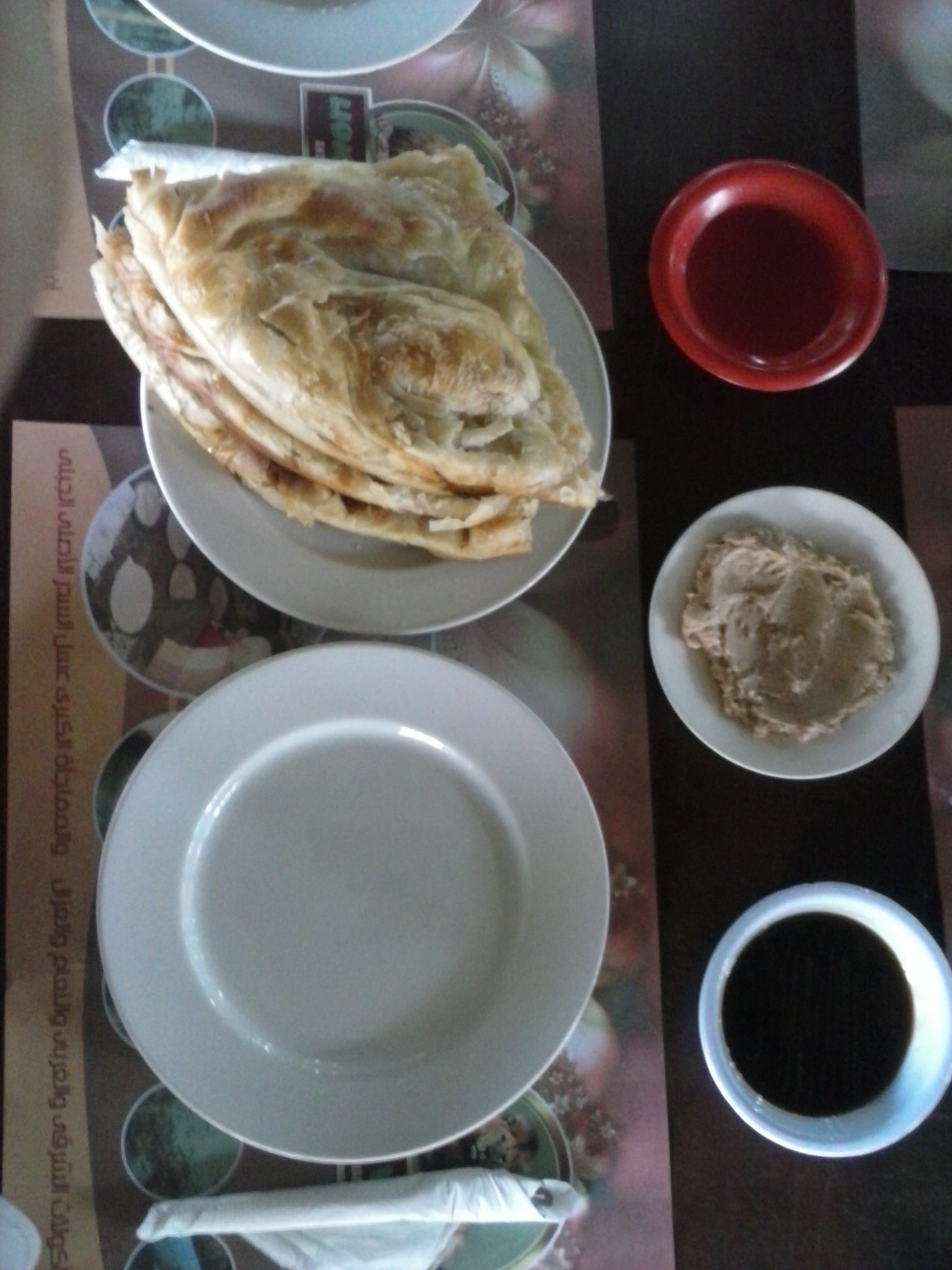 A traditional Egyptian breakfast table with bread, cheese, beans and salads