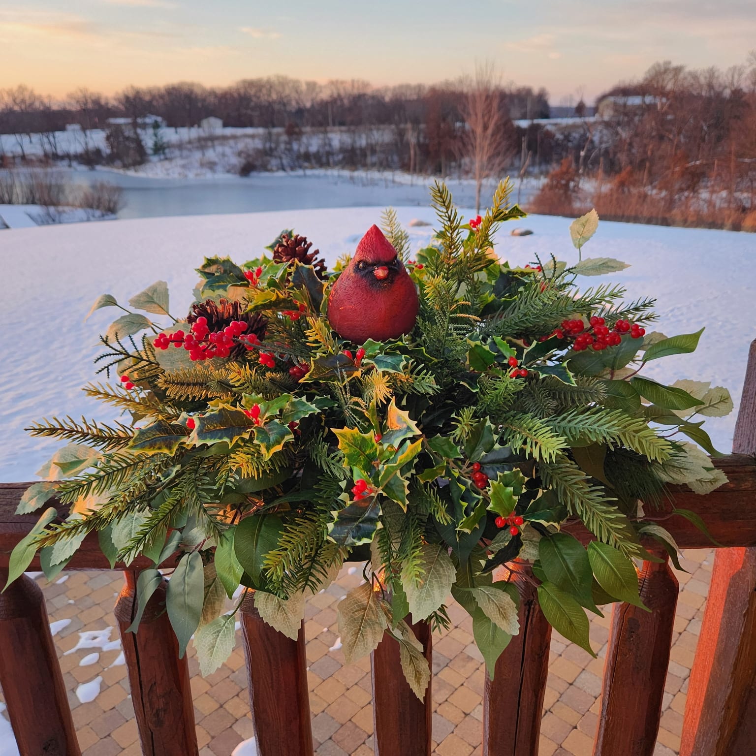 Ferns with red flowers and cardinal on top