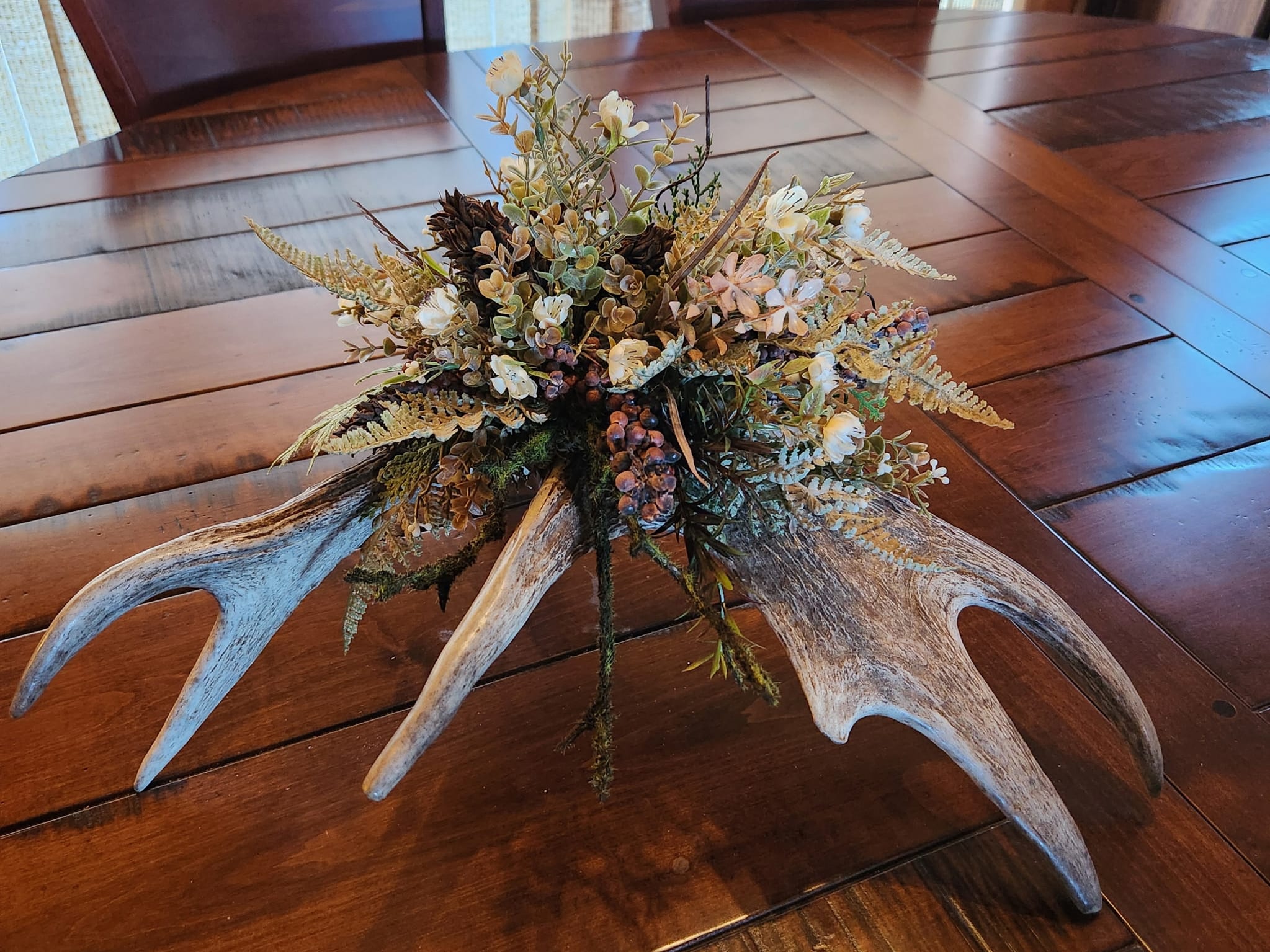 Moose antlers with forest plants