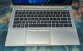 Close-up of HP EliteBook laptop keyboard and touchpad