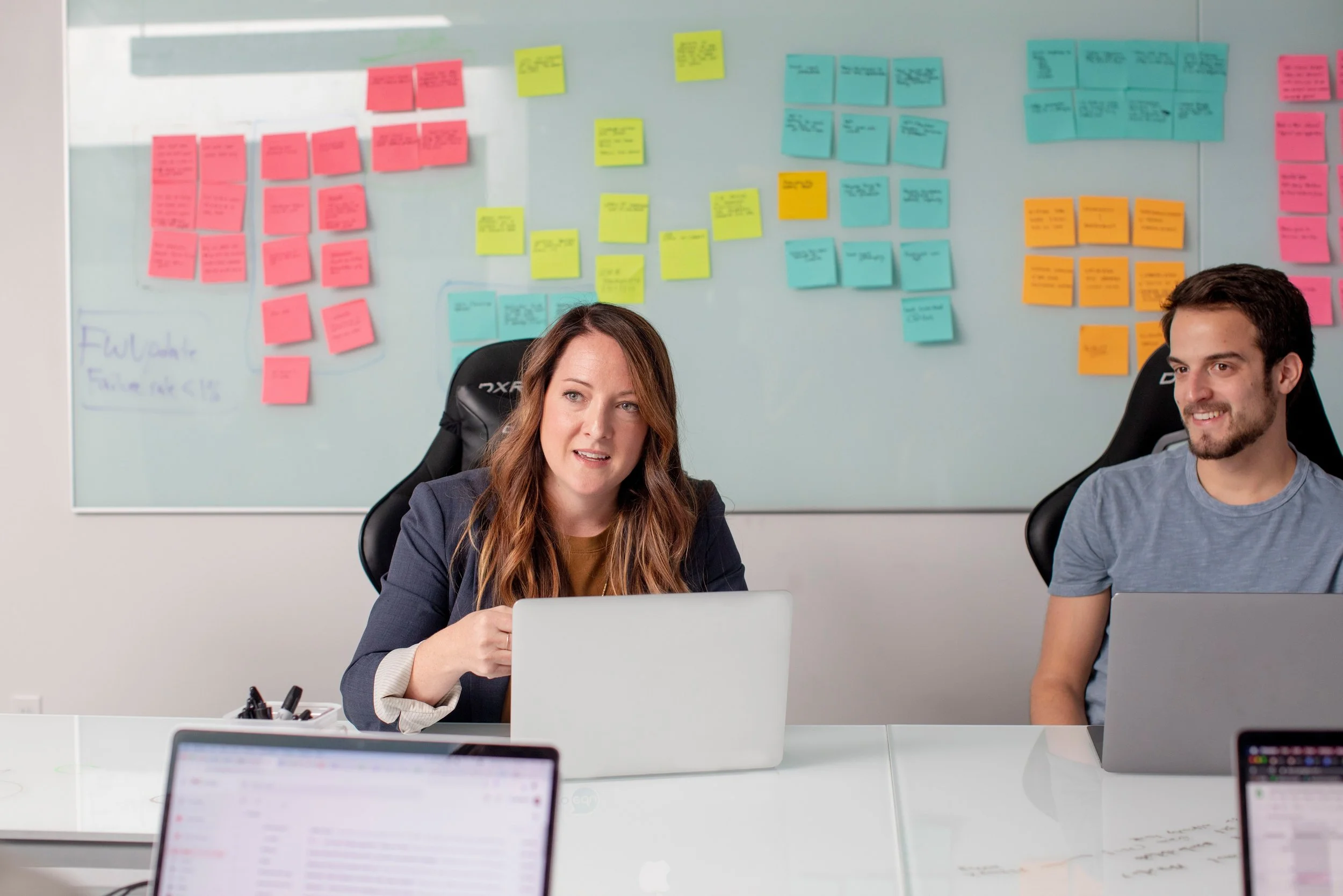 Product Manager holding a team meeting