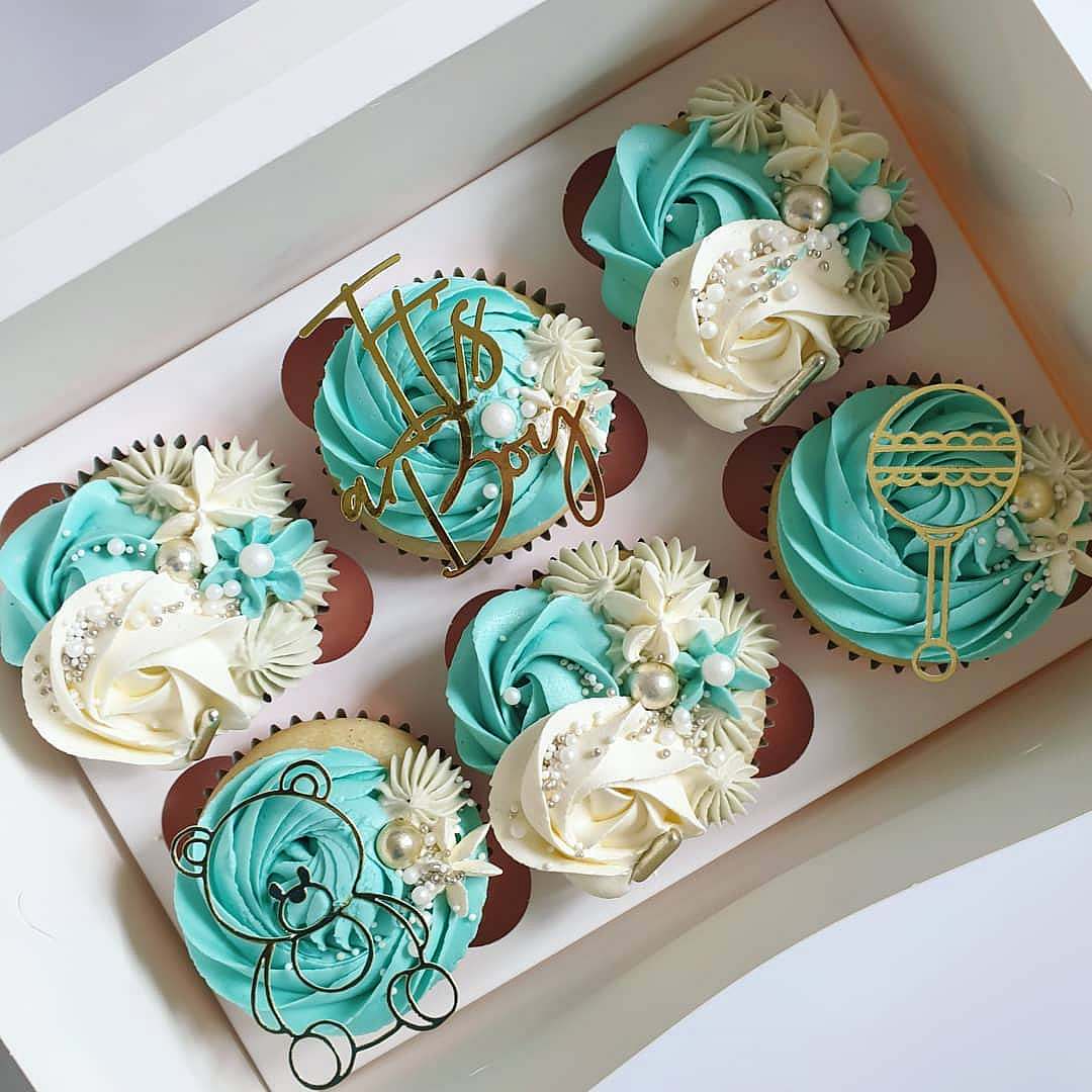 Gender reveal box of cupcakes.