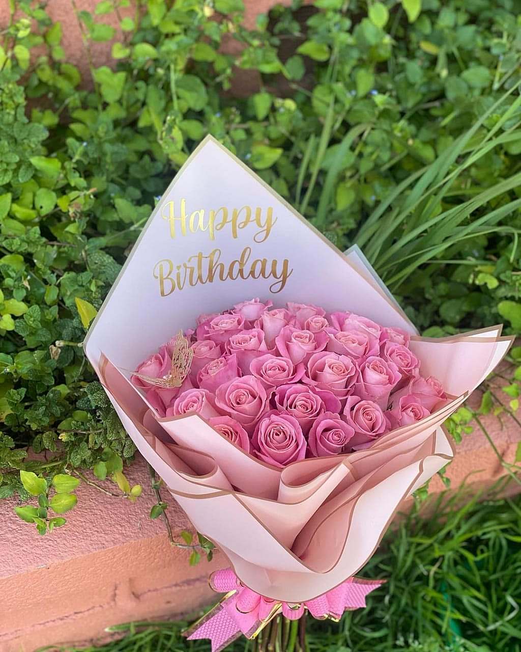 Pink customized flowers with a butterfly - Image 2