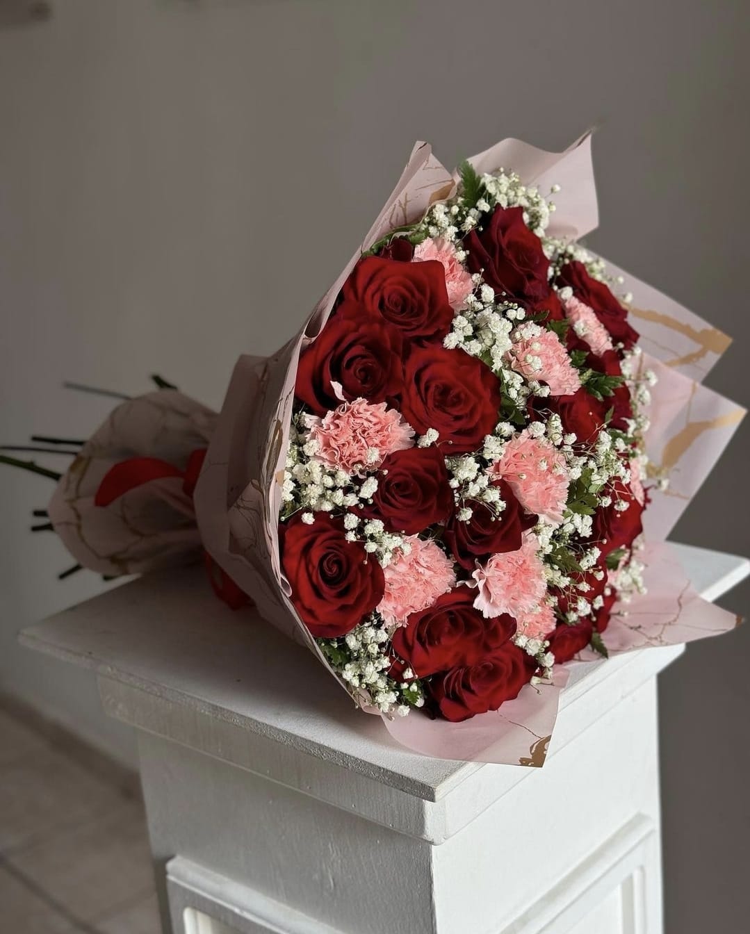 Bouquet of red roses and carnations