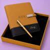 Personalized tan and black smart notebook with built-in wireless charging pad and matching engraved pen in a luxury gift box