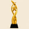 Tall metallic gold star tower trophy award on a solid black pedestal base for competition winners in Nairobi Kenya