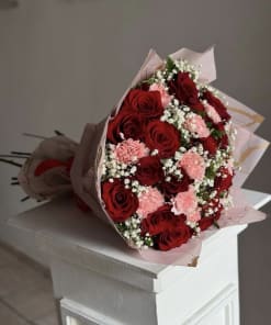 Bouquet of red roses and carnations