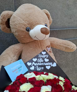 Teddy bear and flowers
