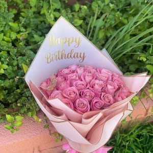 Pink customized flowers with a butterfly