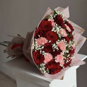 Bouquet of red roses and carnations