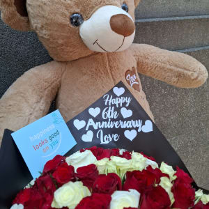 Teddy bear and flowers