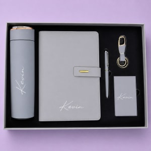 Executive personalized gift set with white custom branded notebook and vertical laser engraved thermal flask by DnD Gifts Kenya