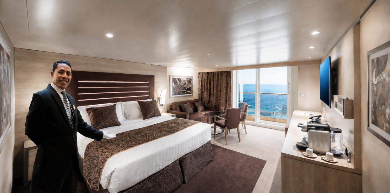 MSC Yacht Club suite with butler, king bed, bathrobes, refreshment console, and ocean view