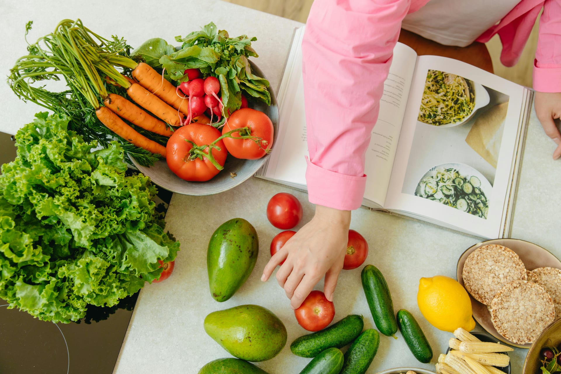 Vegetables on a table with an open book