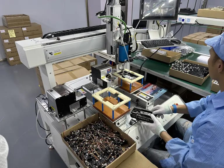 Factory assembly line for in-vehicle infotainment manufacturing