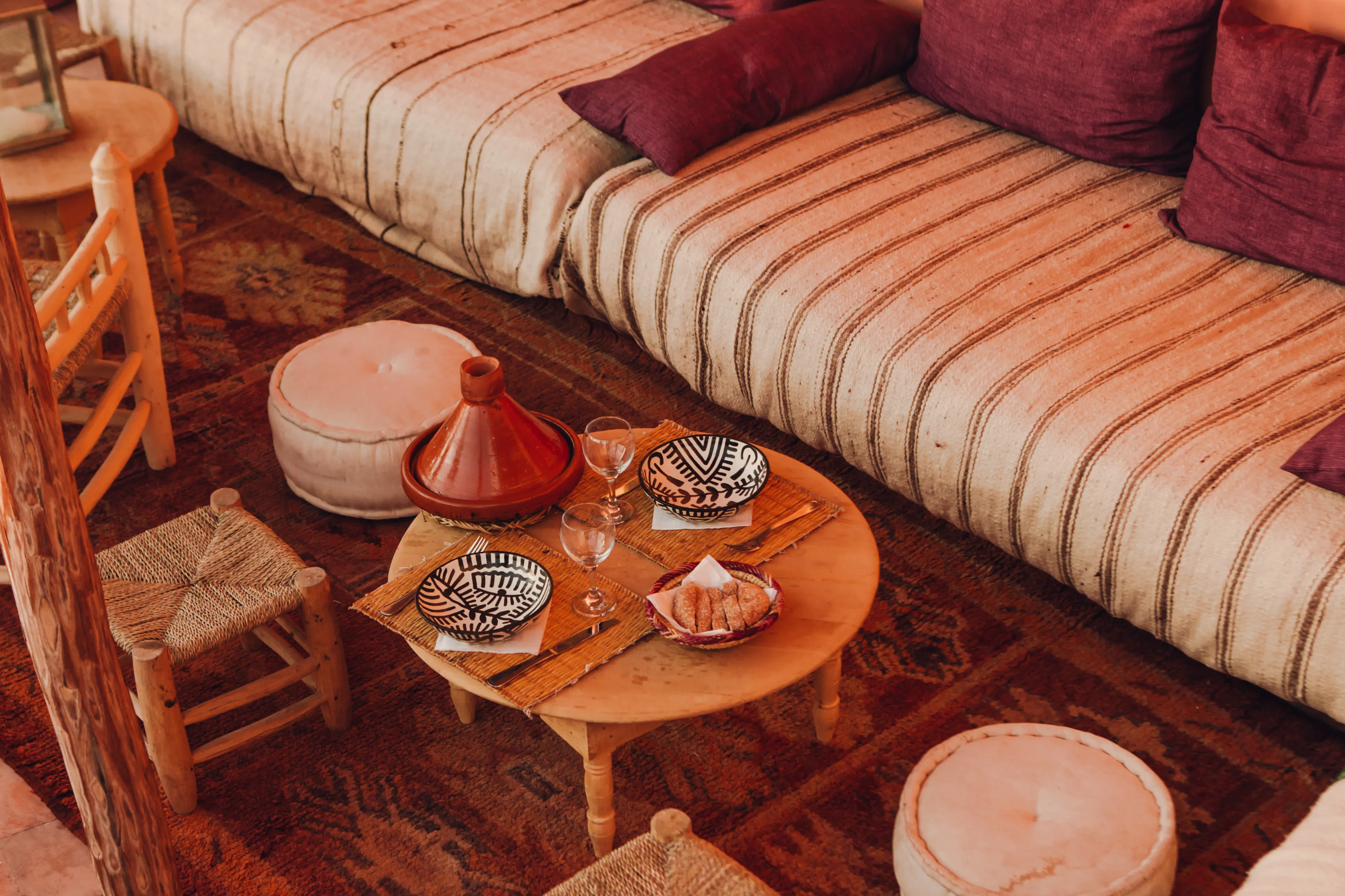 Comfortable pergola seating - Traditional Moroccan outdoor lounge at Riad Bensaid