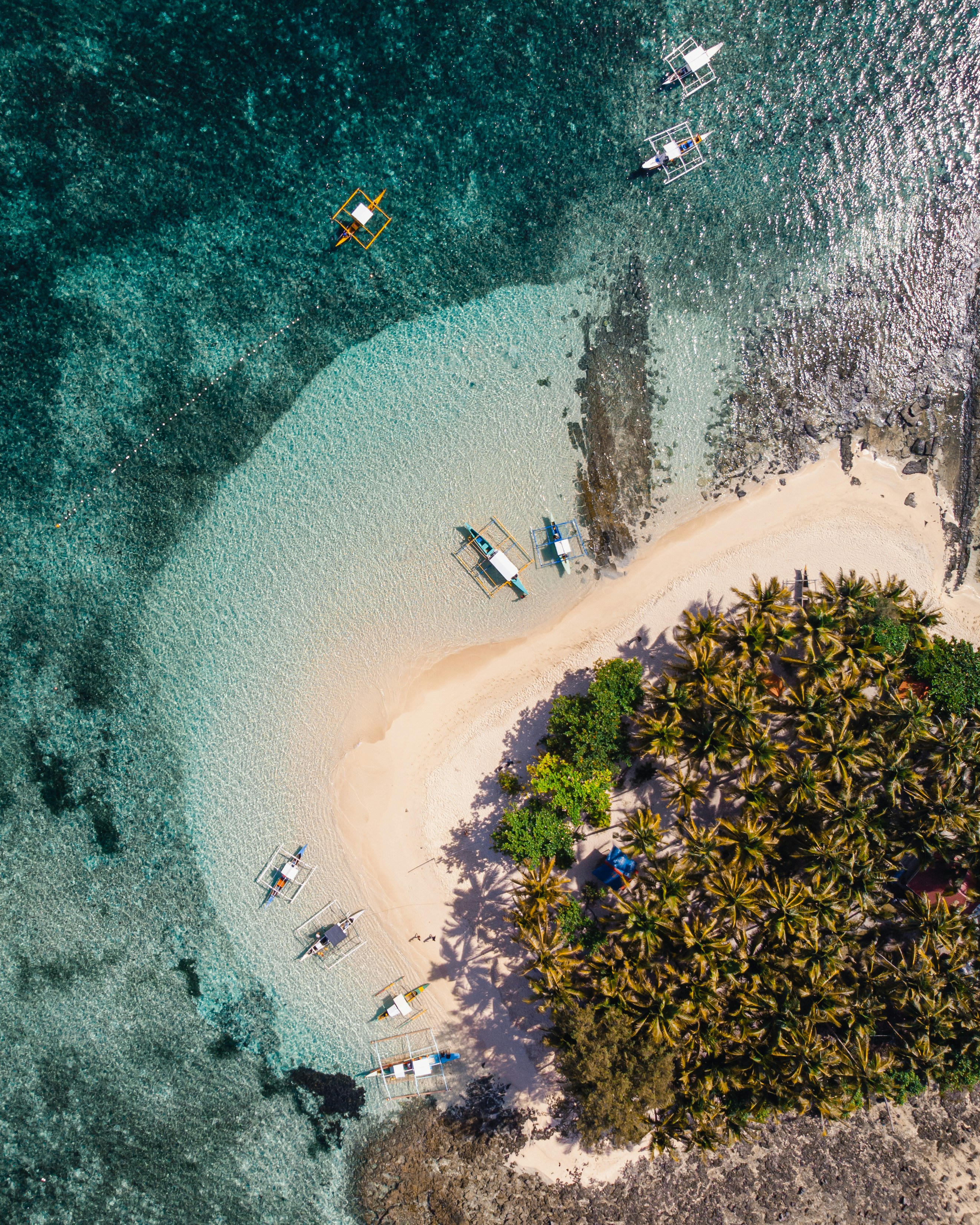 Drone shot of the beach and boats in the small island of Guyam, Siargao, Philippines