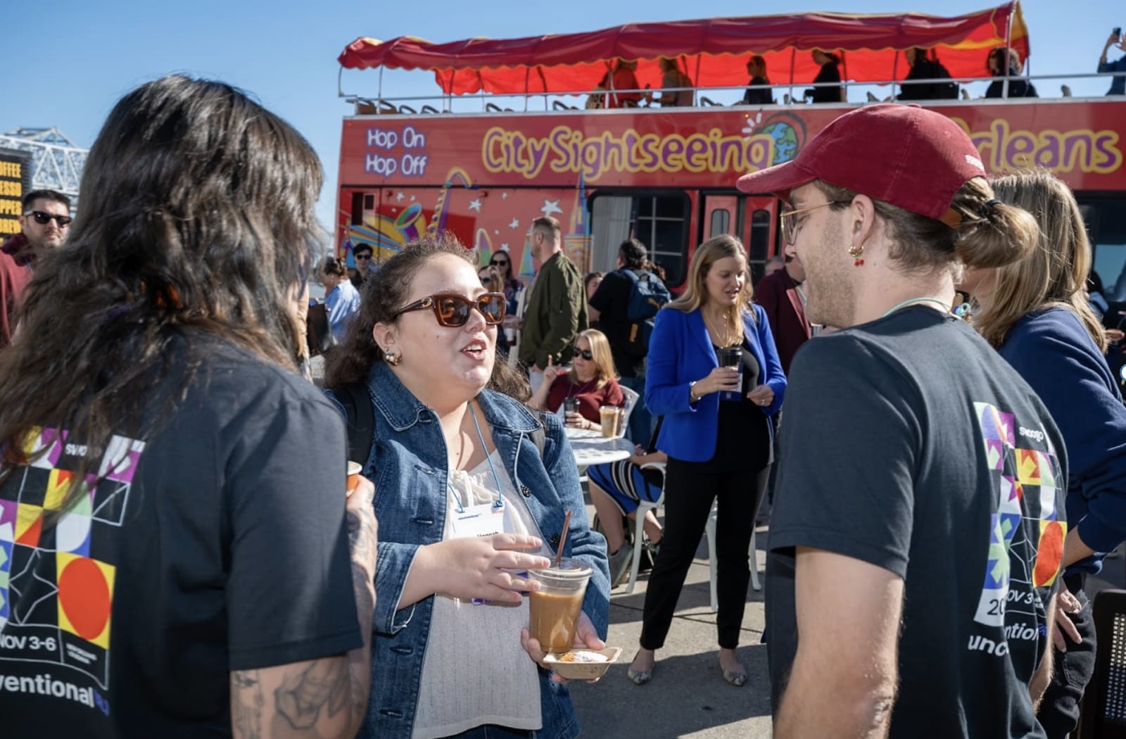 Attendees arriving at Unconventional (IRL) on a double-decker bus in New Orleans