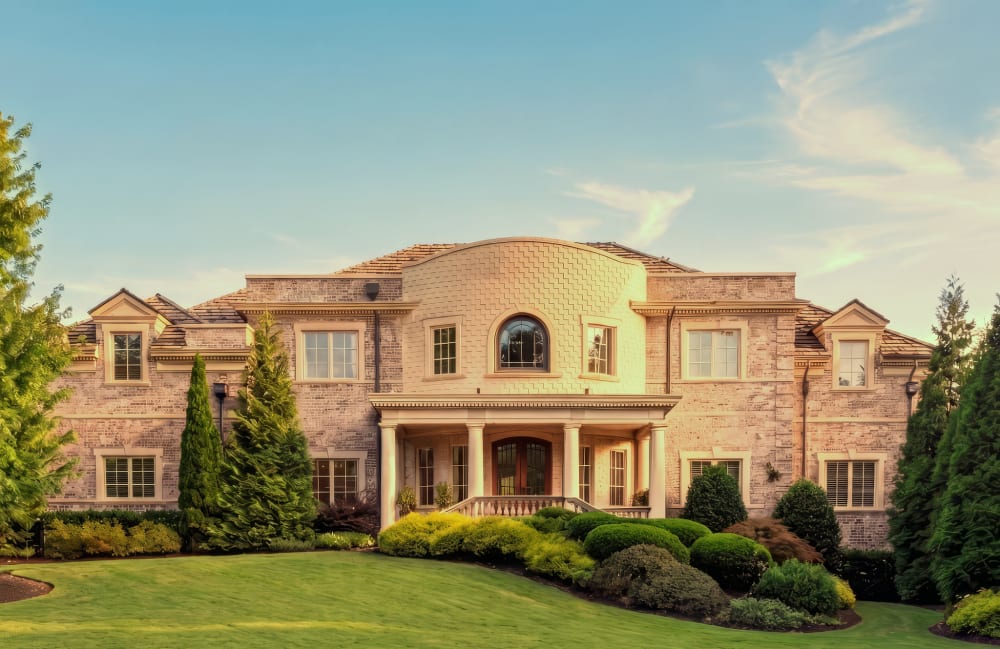 Stone facade and landscaped entrance at Fauzan Country Club