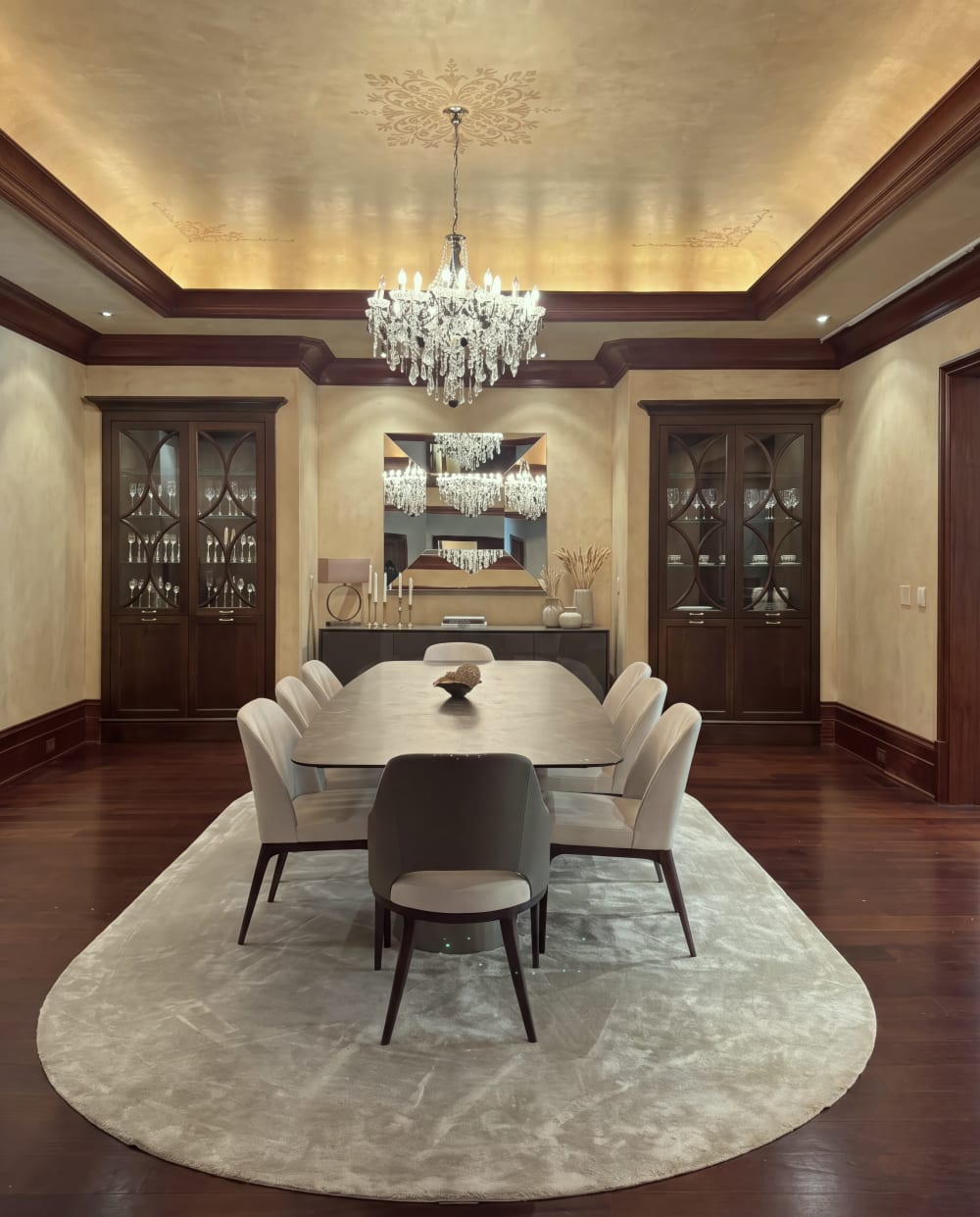 Dining room with a chandelier and display cabinets at Fauzan Country Club