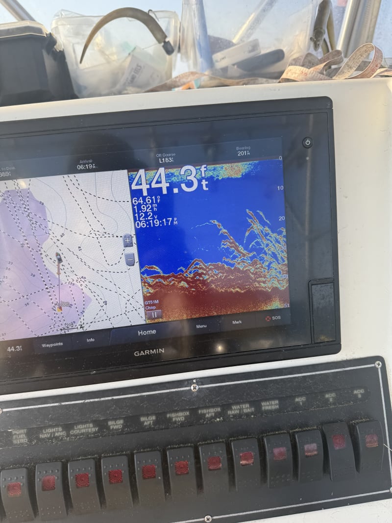 Garmin sonar showing thick bait schools in 44 feet of water aboard the Hula Dog