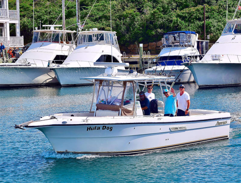 The Hula Dog charter boat with crew at Old Harbor, Block Island