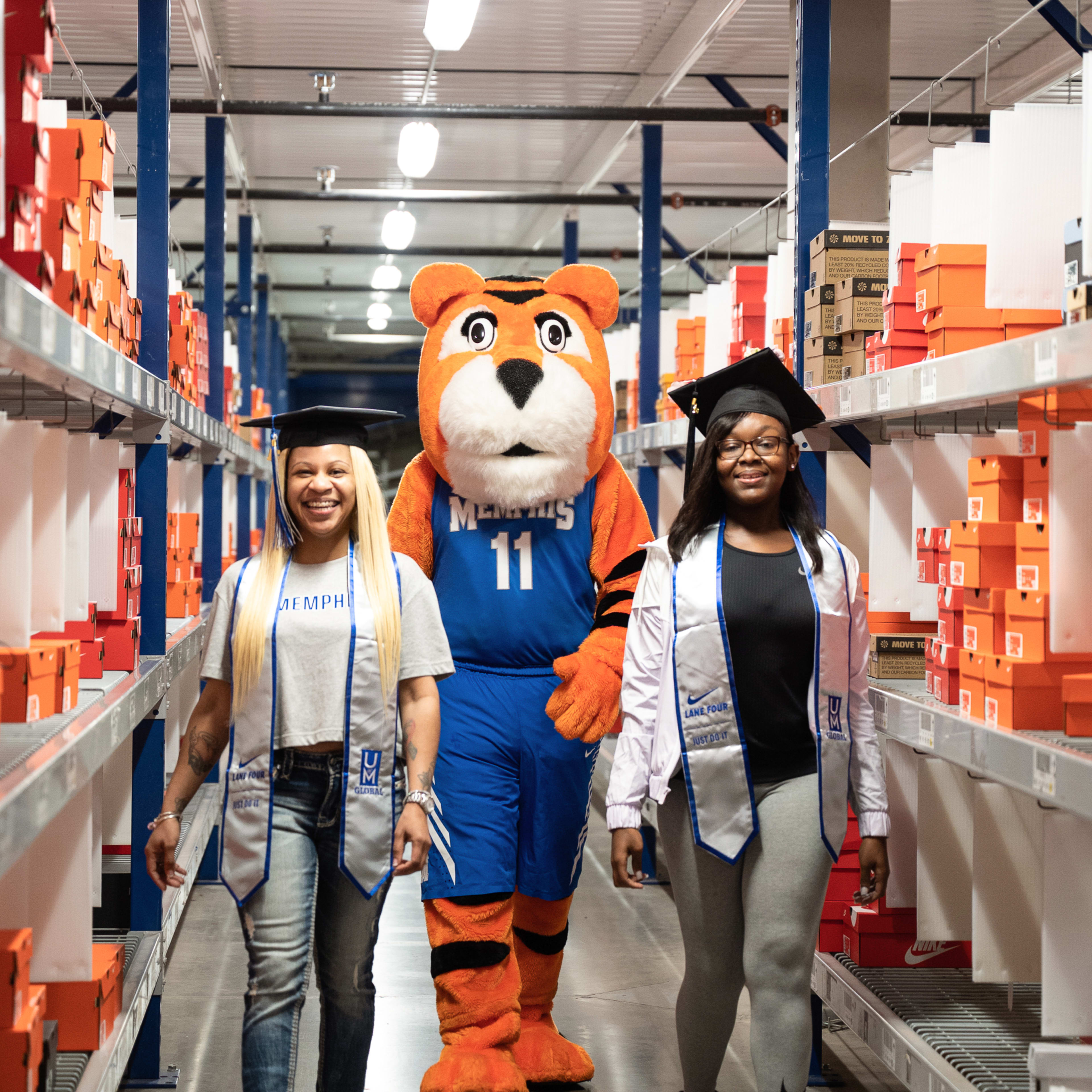 2021 Lane 4 graduates. Graduate Renicsha Wadley (pictured left) received her degree in Organizational Leadership. Graduate Demetria Ingram (pictured right) received her degree in Finance.