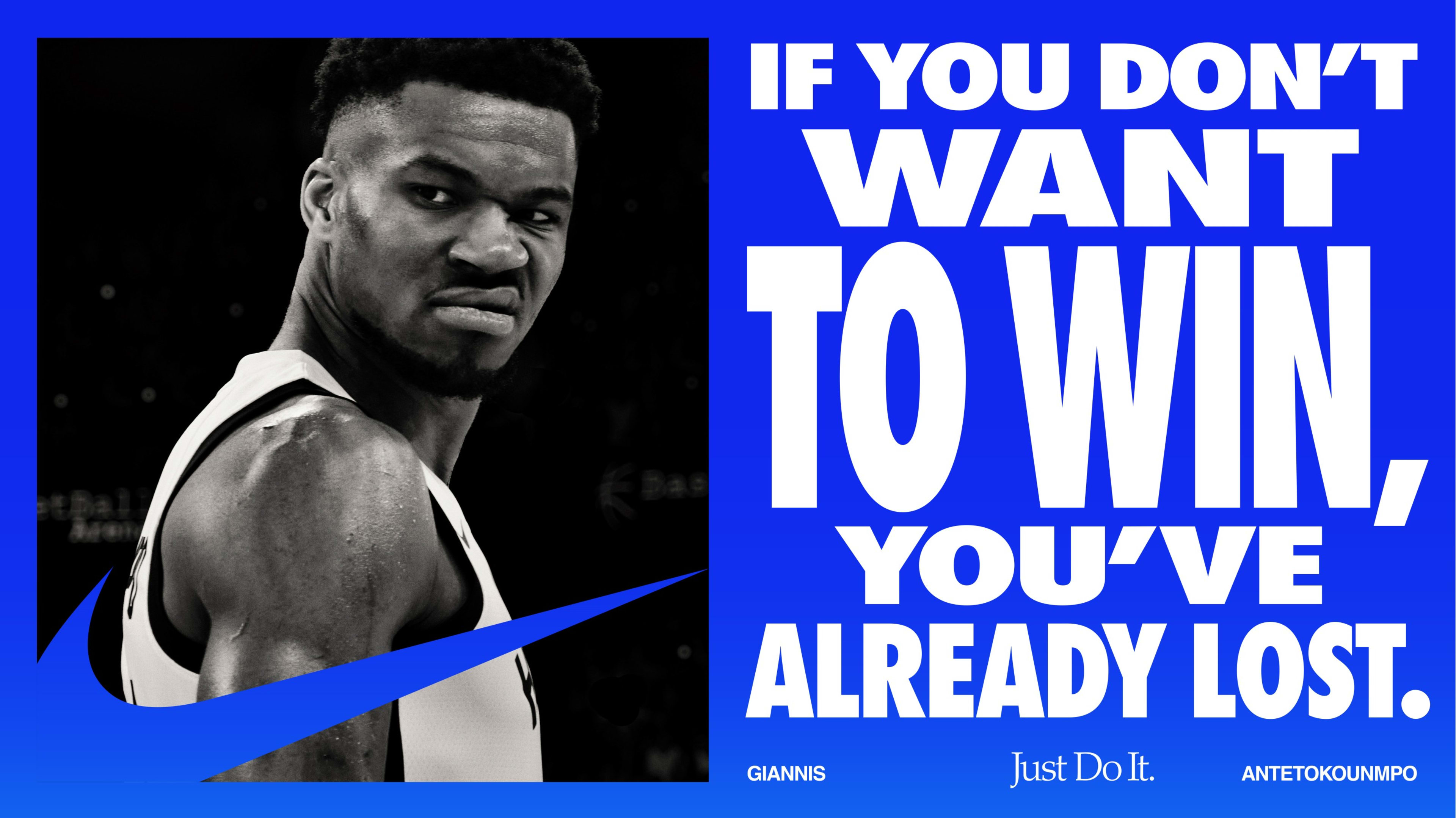 Blue Nike campaign card of featuring black and white photo of Giannis Antetokounmpo with the caption, "If you don't want to win, you've already lost."