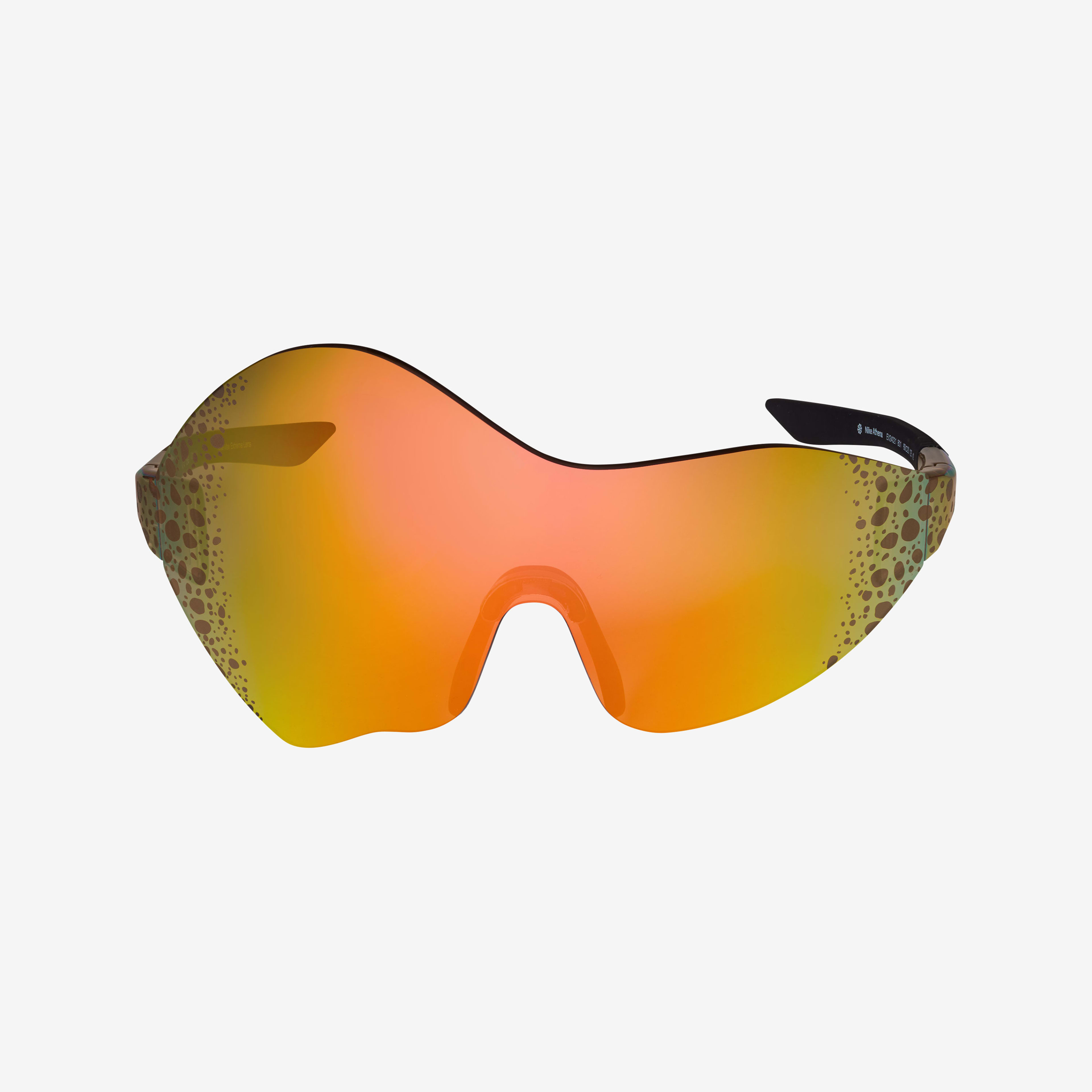 Front view of Nike Athena sunglasses highlighting the asymmetrical nature of the mirrored orange glass lens that wraps from front to the temple. Electric grpahic appears at the temples, which is a pattern of brown/black speckled spots. Glasses float on a white background.