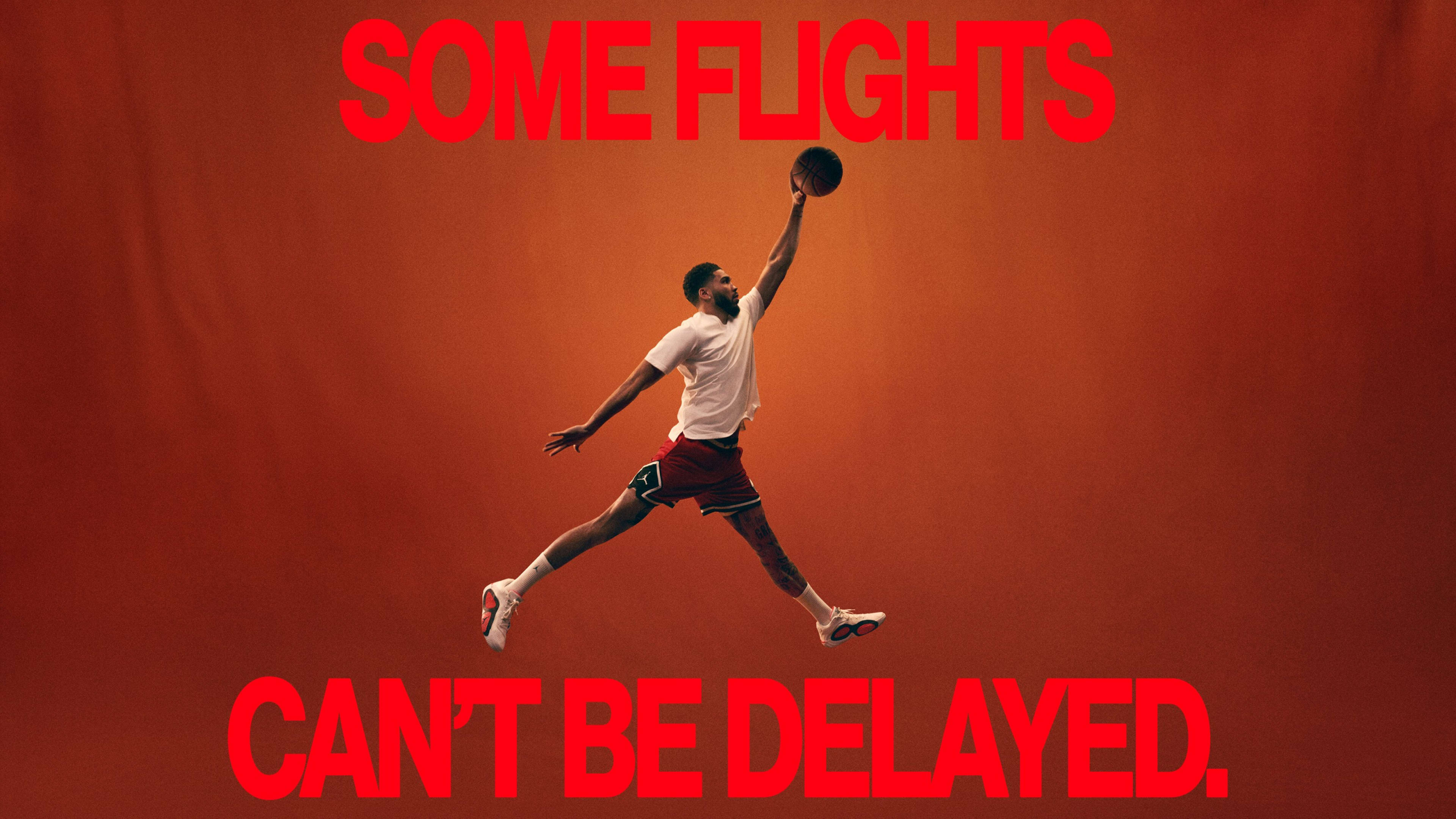 A basketball athlete strikes the Air Jordan dunk pose on an orange background. A caption in red font reads, "Some flights can't be delayed."