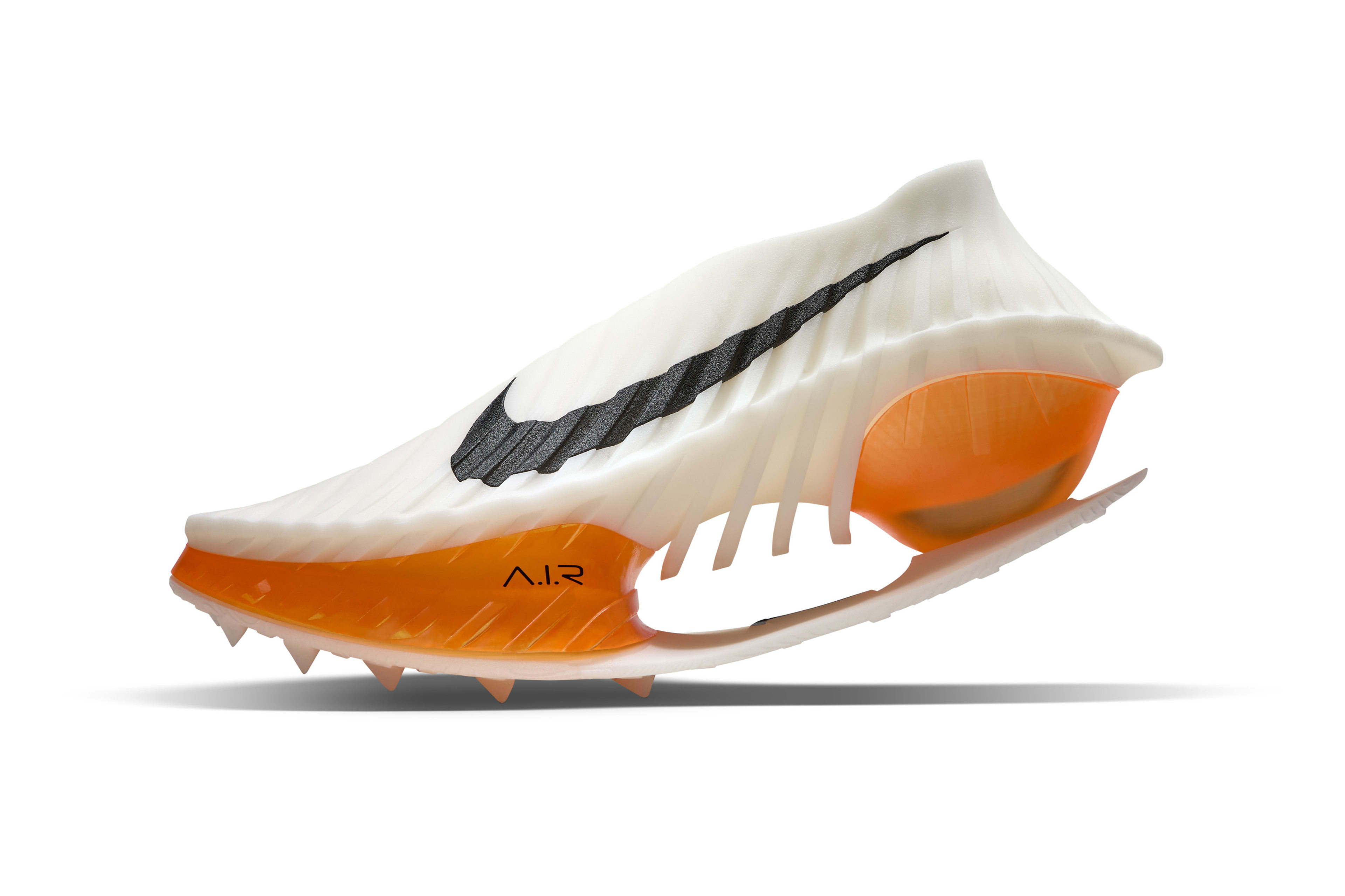 Left view of shoe concept for Rai Benjamin in white featuring a ribbed hurdle inspired mid foot plate, a forefoot air unit contained on the lateral side and exposed on the medial side.