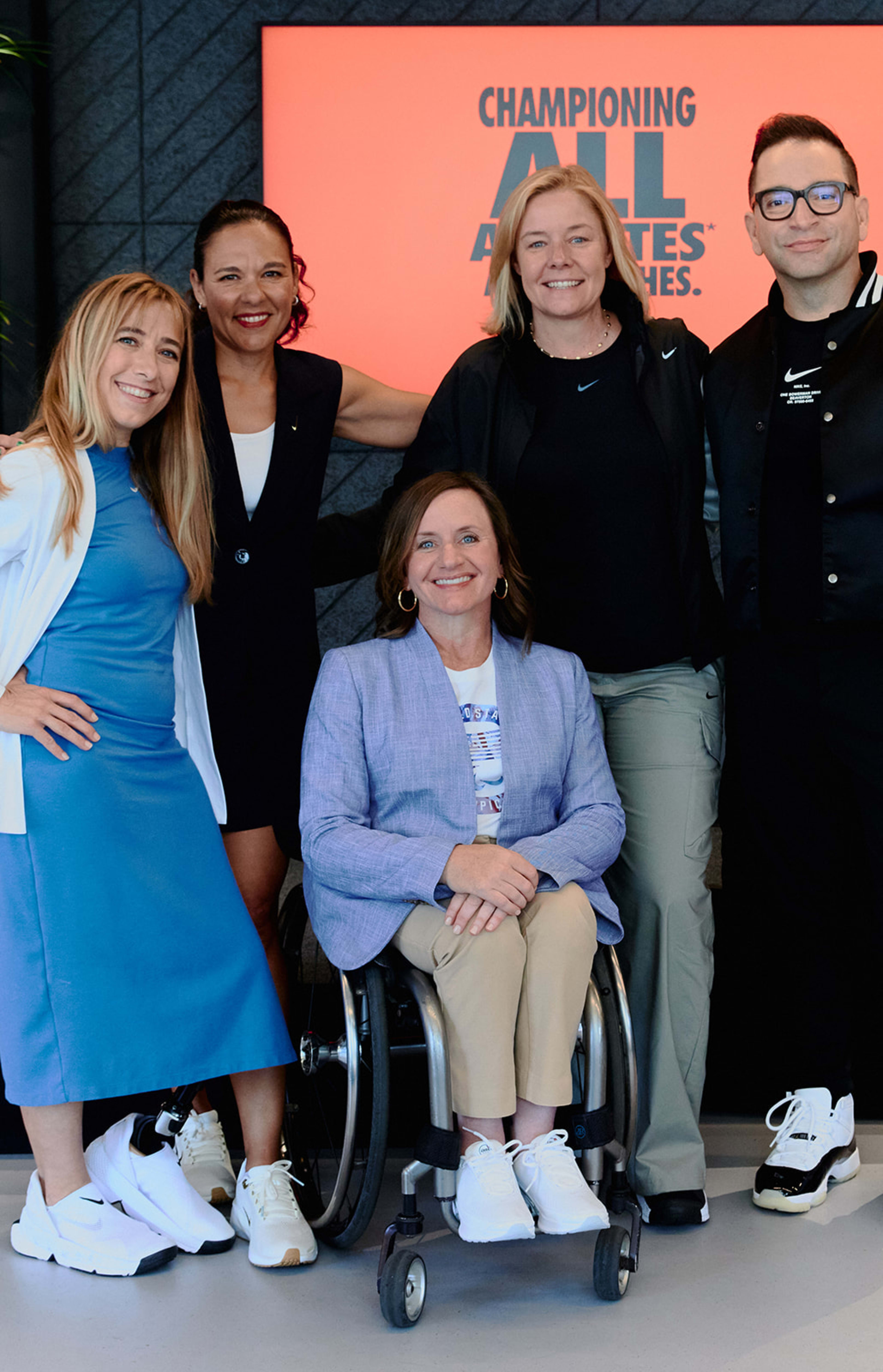 Nike and the USOPC announced their GameOn program at an event in Paris. From left to right, Sarah Reinertsen, Paralympian and Nike Lead Professional, Sports Marketing; Vanessa Garcia-Brito, Nike Chief Impact Officer; Sarah Hirshland, CEO, U.S. Olympic & Paralympic Committee; James Loduca, Nike Vice President, Diversity, Equity, Inclusion; seated is Dr. Cheri Blauwet, Paralympian and Sports Medicine Physician, Professor at Harvard Medical School, and Chief Medical Officer of Spaulding Rehabilitation/Mass General Brigham.