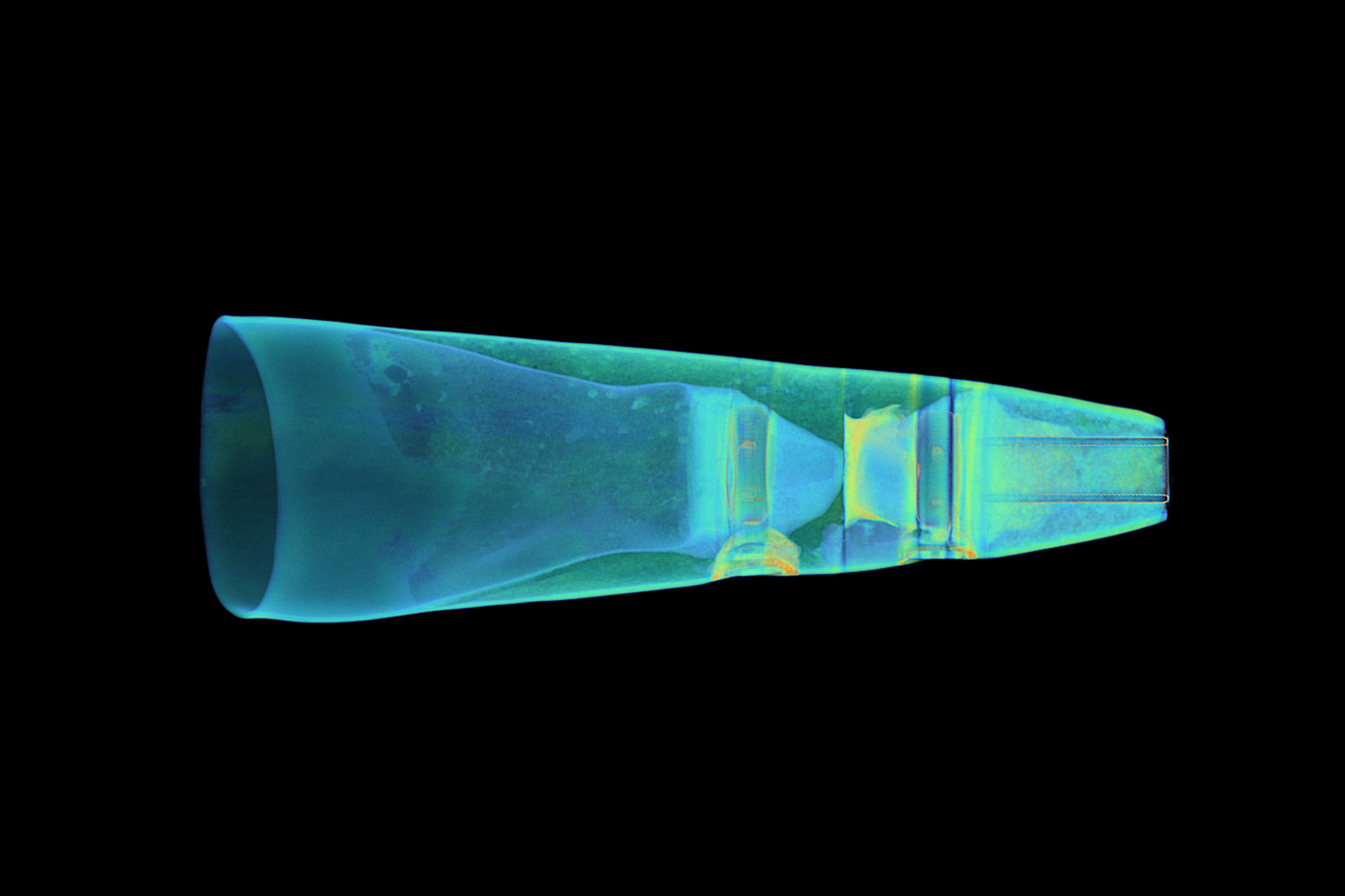 A colored CT scan of Bebe Vio's prosthetic sits against a black background. The blue, green, and yellow imagery shows the different internal components and shape of parts inside the prosthetic.