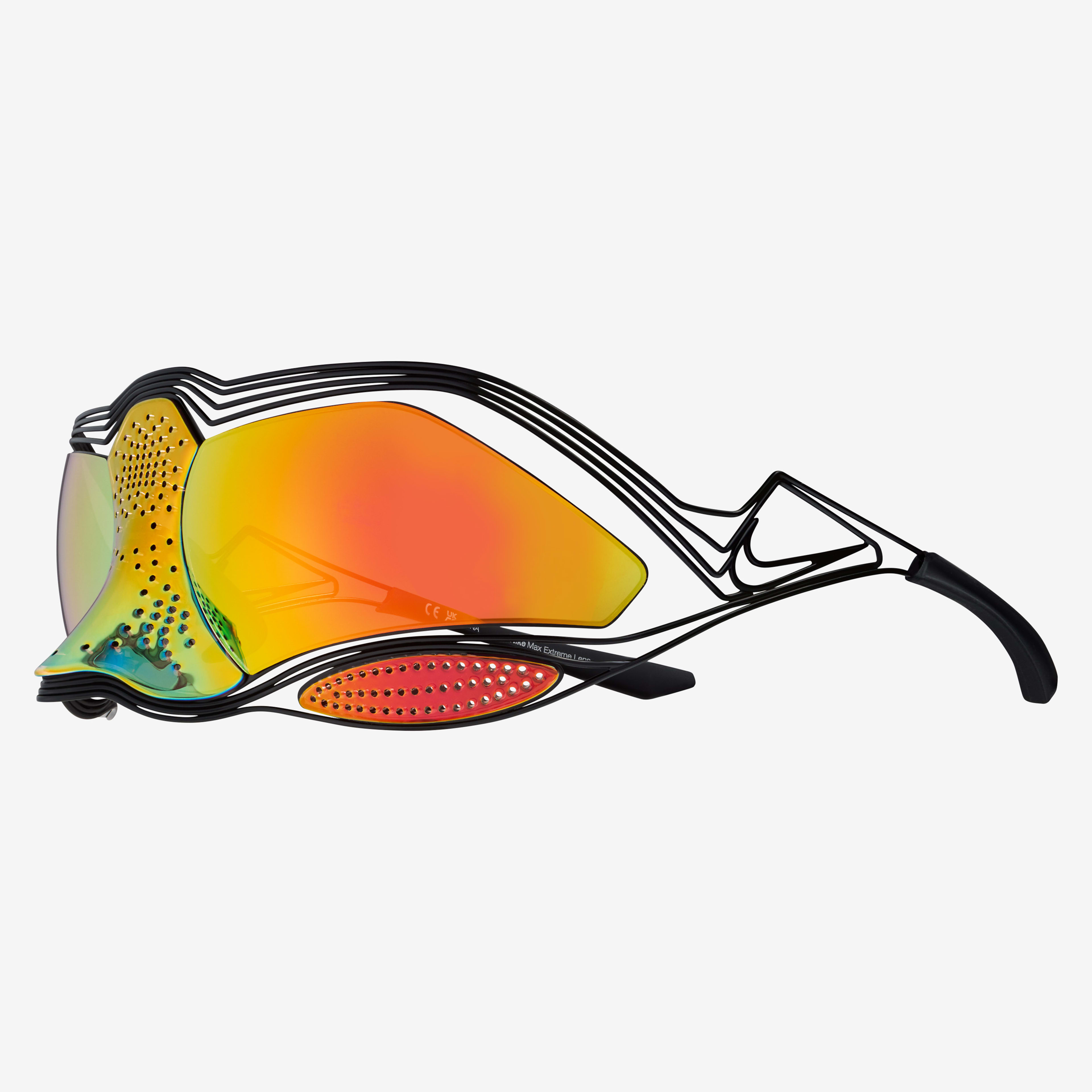 Side view of the Nike Zeus sunglasses, showcasing the wrapping orange lenses, fluted perforations on nose, and the titanium frame. Translucent orange lenses over the eyes shifts to transluscent green and blue over the nose. Glasses float on a white background.