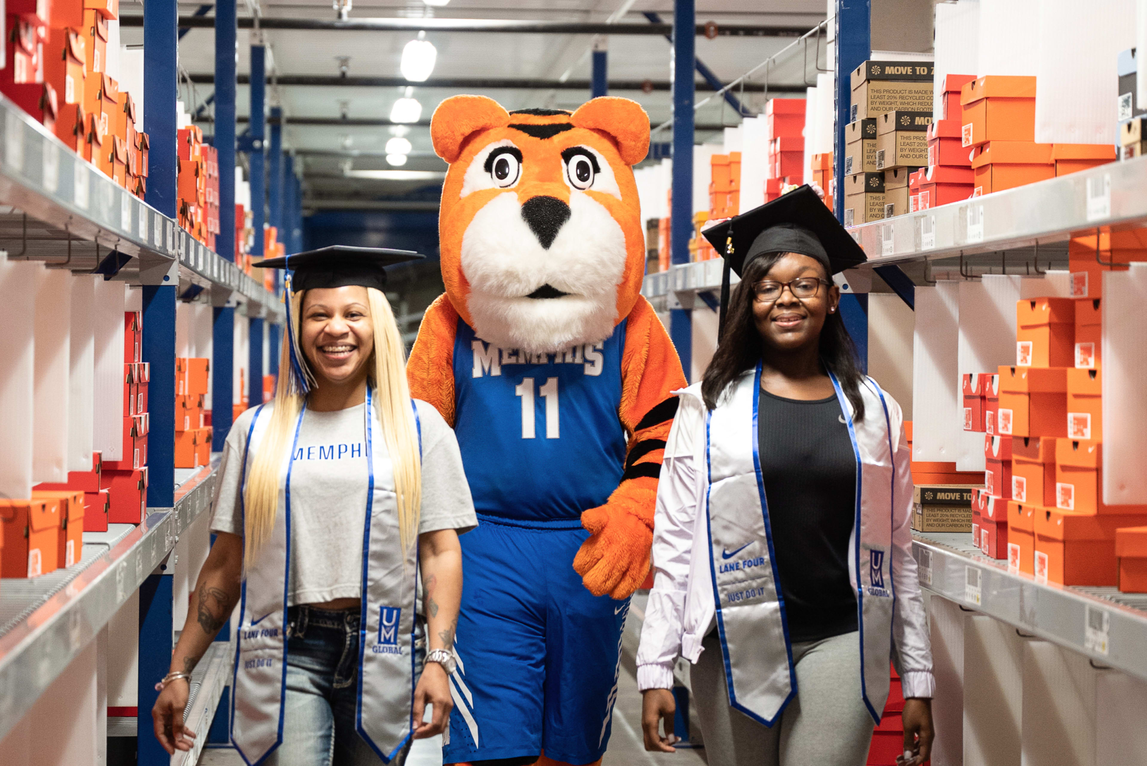 2021 Lane 4 graduates. Graduate Renicsha Wadley (pictured left) received her degree in Organizational Leadership. Graduate Demetria Ingram (pictured right) received her degree in Finance.