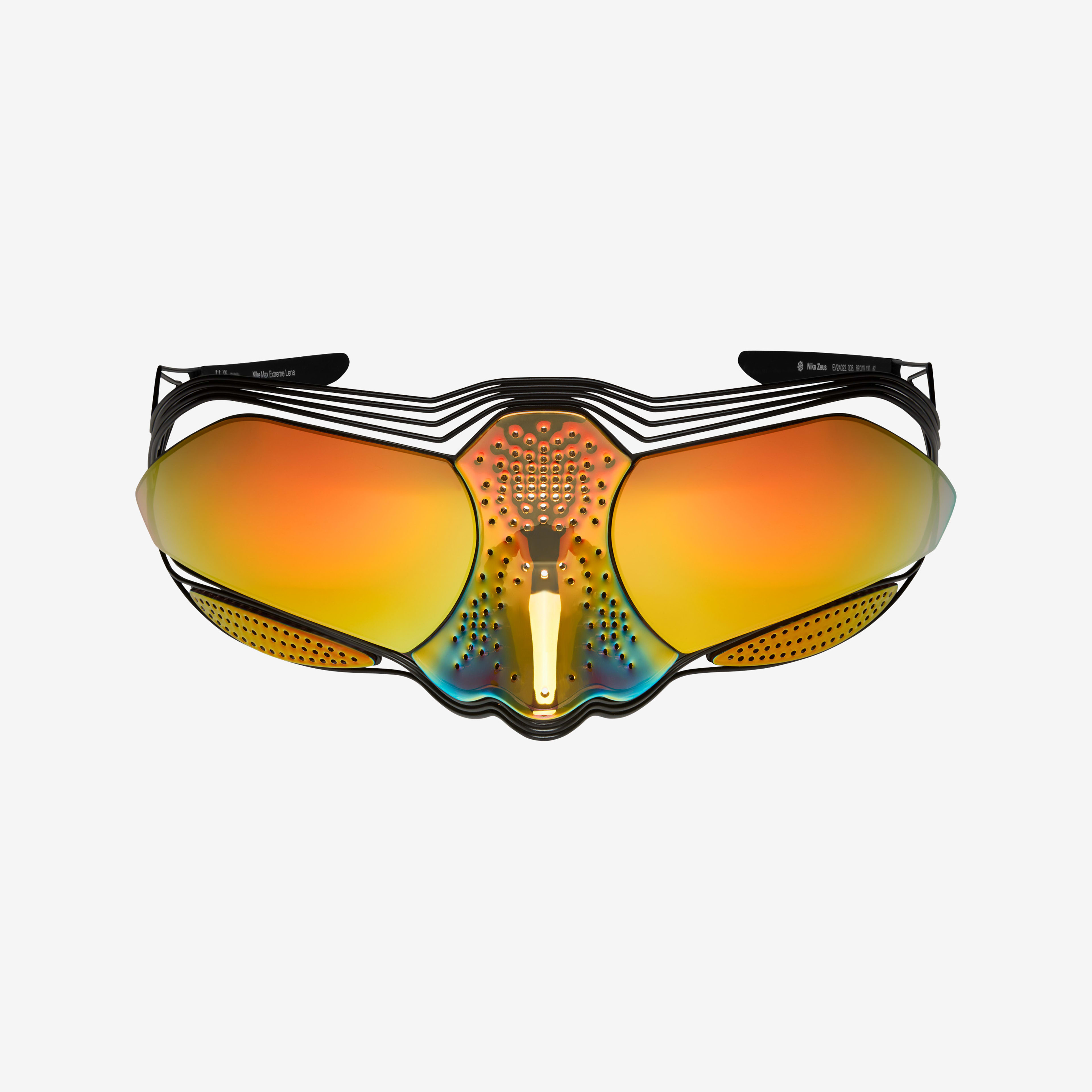 Front view of Nike Zeus sunglasses, which is mask-like. Lenses are iridescent orange and wrap around. The lens continues over the bridge of the nose and the iridescent orange fades to yellow and then to blue and purple. Glasses float on a white background.