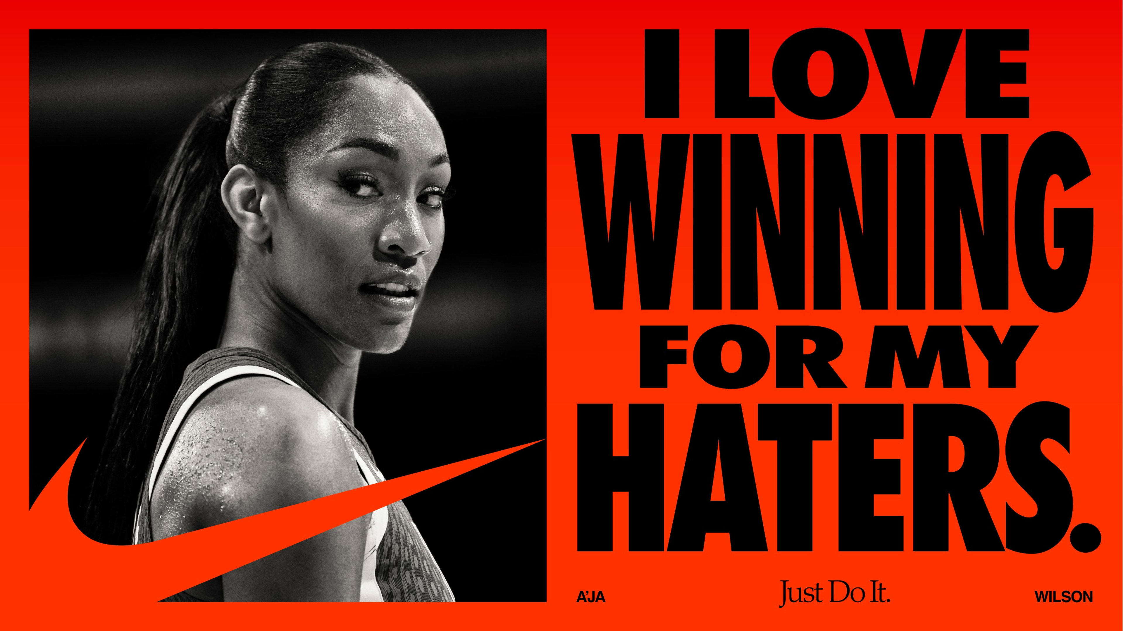 Horizontal poster format. On the left, a black and white photo of Aja Wilson looking directly at the camera. On the right, a headline reads, "I love winning for my haters." appearing in black against a red background.