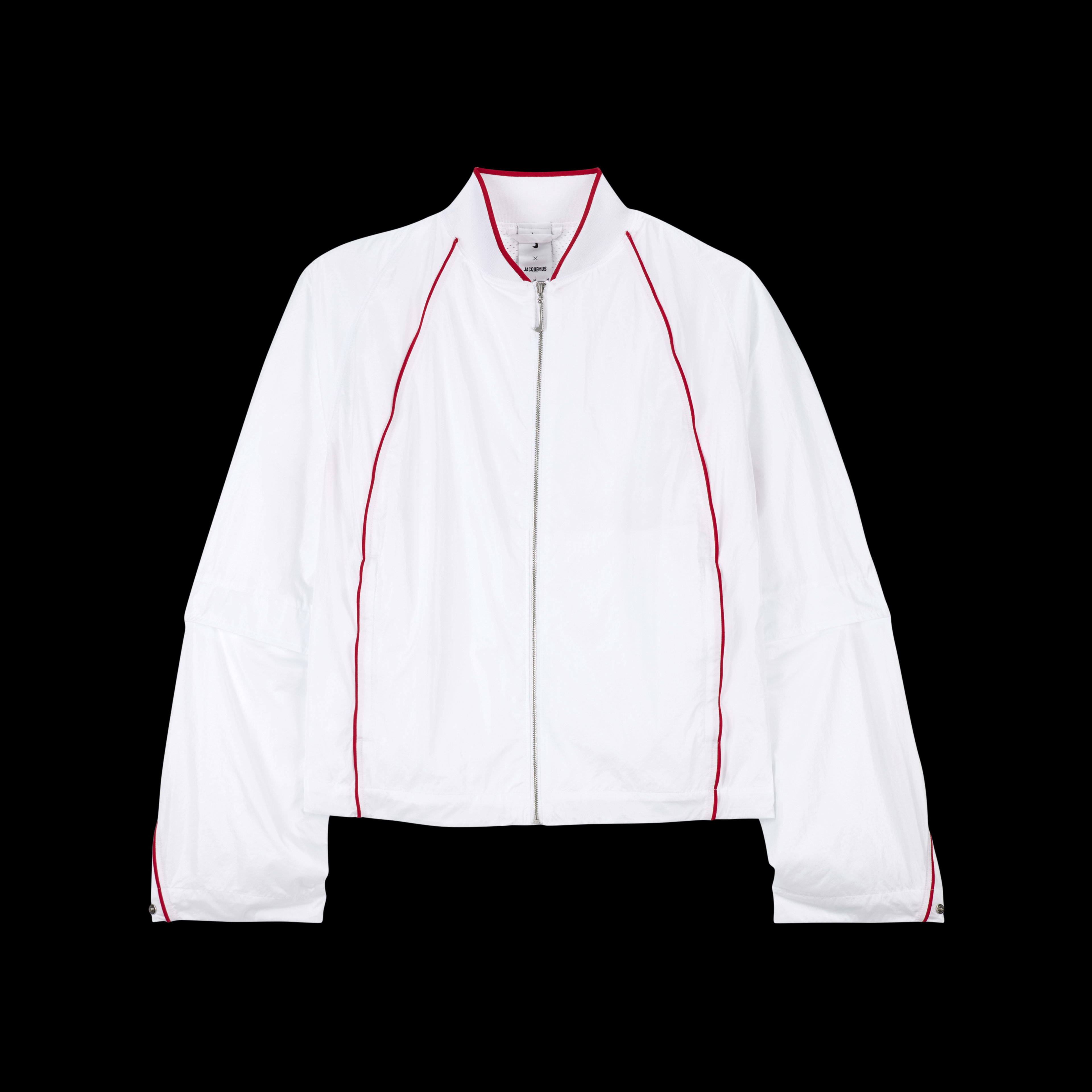 Overhead view of the Nike x Jacquemus Track Jacket in white with university red pinstripes at the neck, across the back and down the sleeve, and on the chest of the jacket. The jacket zipper pull is white in the shape of a Nike Swoosh. The piece floats on a black background.