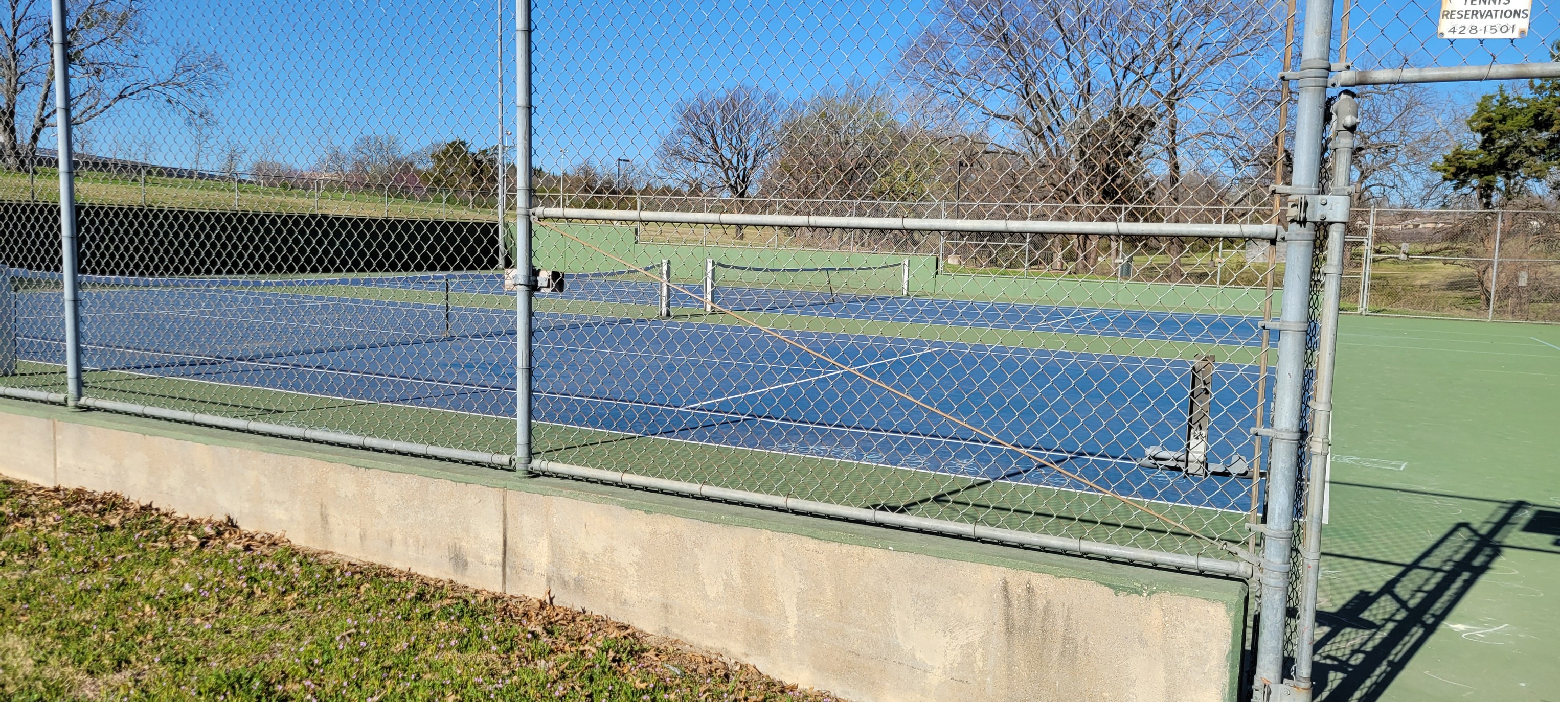 Tennis courts on the south side of Tommie M. Allen Recreation Center where vendor parking begins