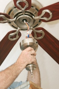 Granite State Electricians - Electrician installing a cieling fanl