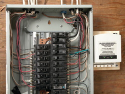 Granite State Electricians - Electric Panel with a home surge protecter