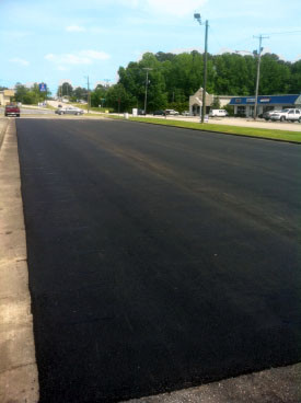 Empty parking lot, paved by Lucas Blacktop