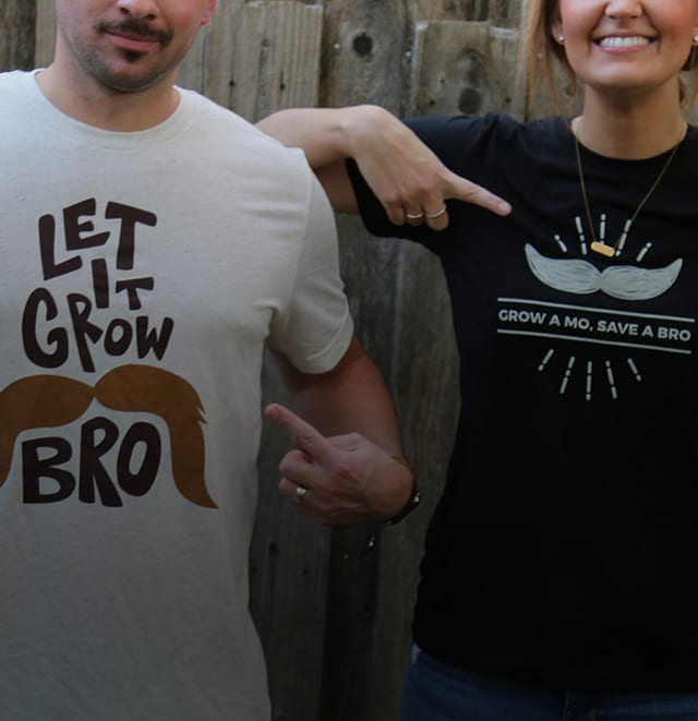 Leverage team members showing off Movember T-shirts.
